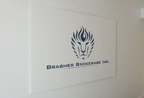Brasher Brokerage, Inc logo printed on the wall